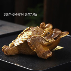 Золота трилапа жаба, що...