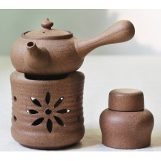 Бежевий керамічний чайник з ажурним різьбленням для варіння пуера