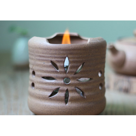 Бежевий керамічний чайник з ажурним різьбленням для варіння пуера